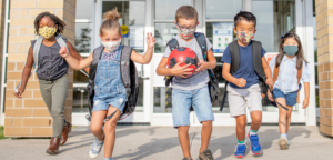 Masked children going back to school during the COVID 19 Pandemic